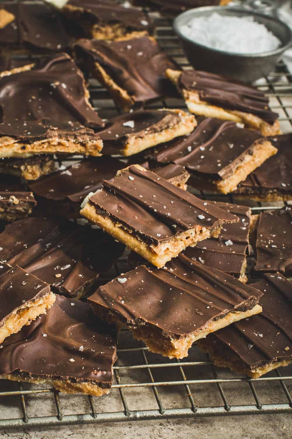 Squares of saltine toffee bark stacked on top of each other.