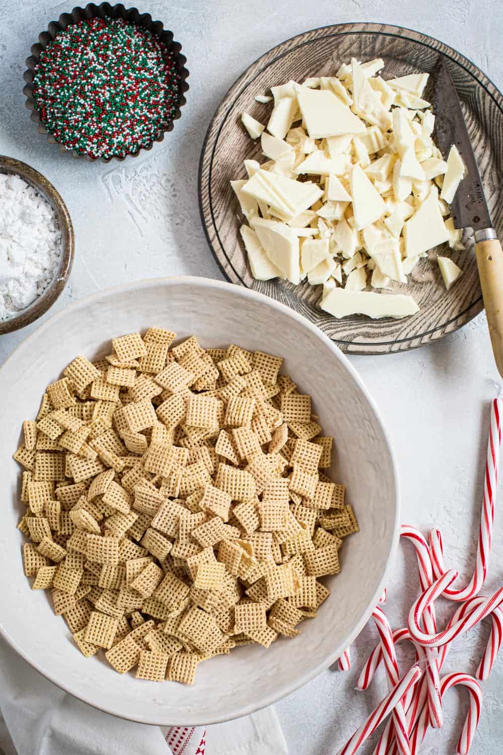 Peppermint puppy chow ingredients in various bowls.