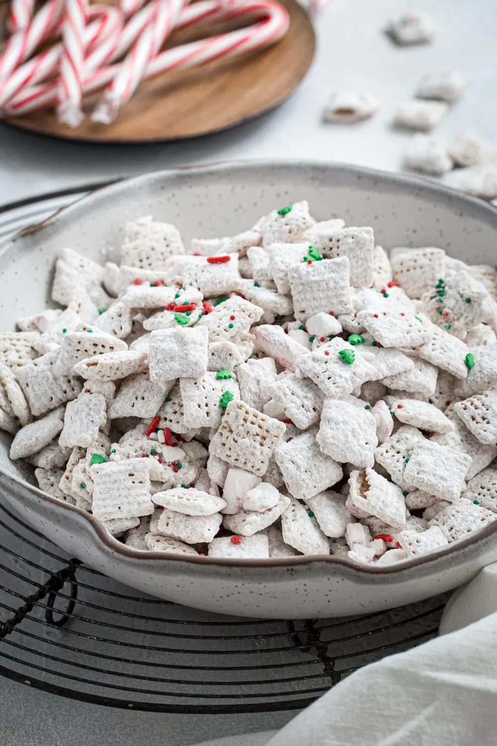Peppermint puppy chow in a white pottery bowl.