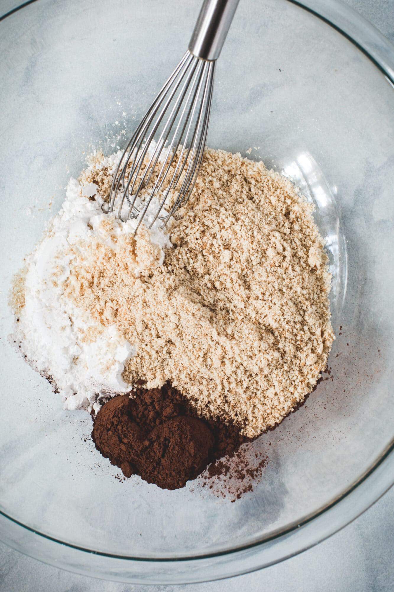Chocolate rum ball dry ingredients in a glass bowl.