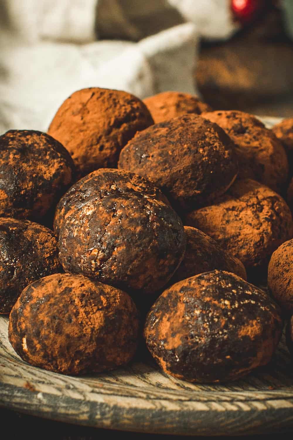 Chocolate Rum Balls stacked on each other.
