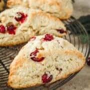 Cranberry scones on a wire rack.