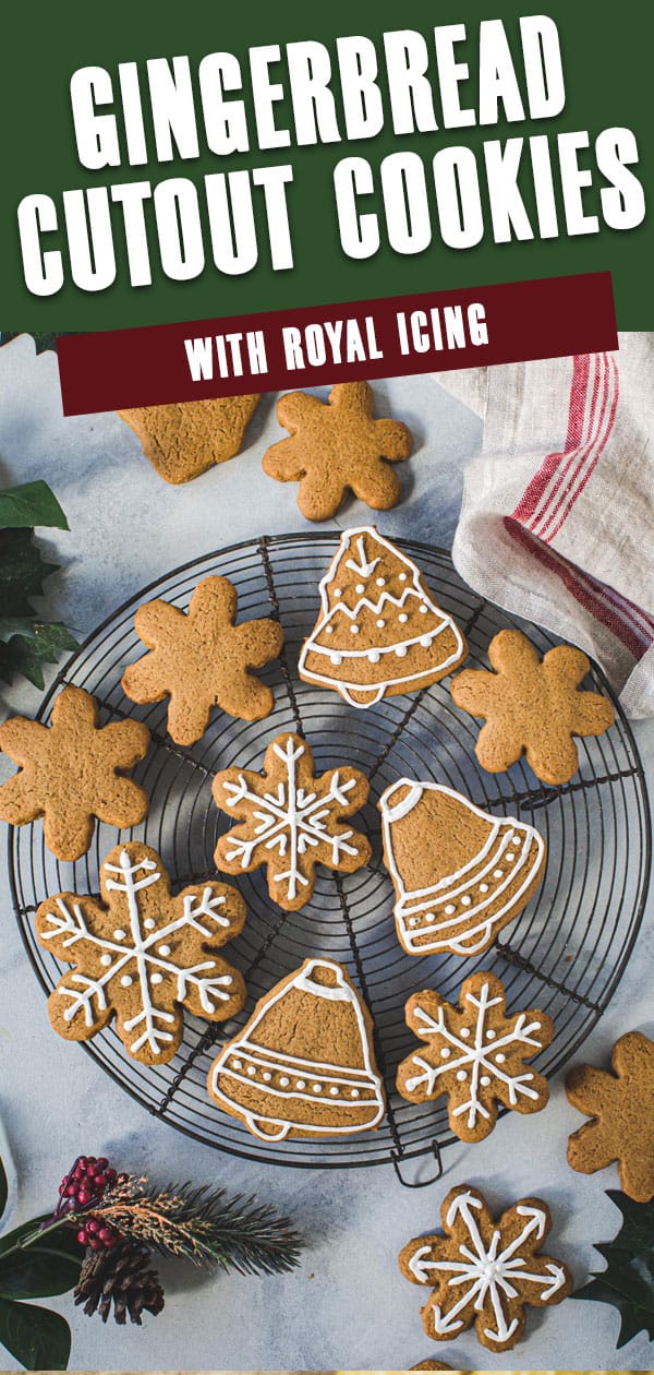 Cutout gingerbread cookies on a wire rack with white title for Pinterest.