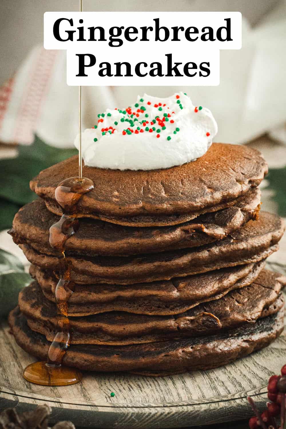 Stacked gingerbread pancakes with whipp