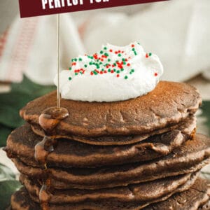 Gingerbread Pancakes with syrup drizzling down the side and white title for Pinterest.