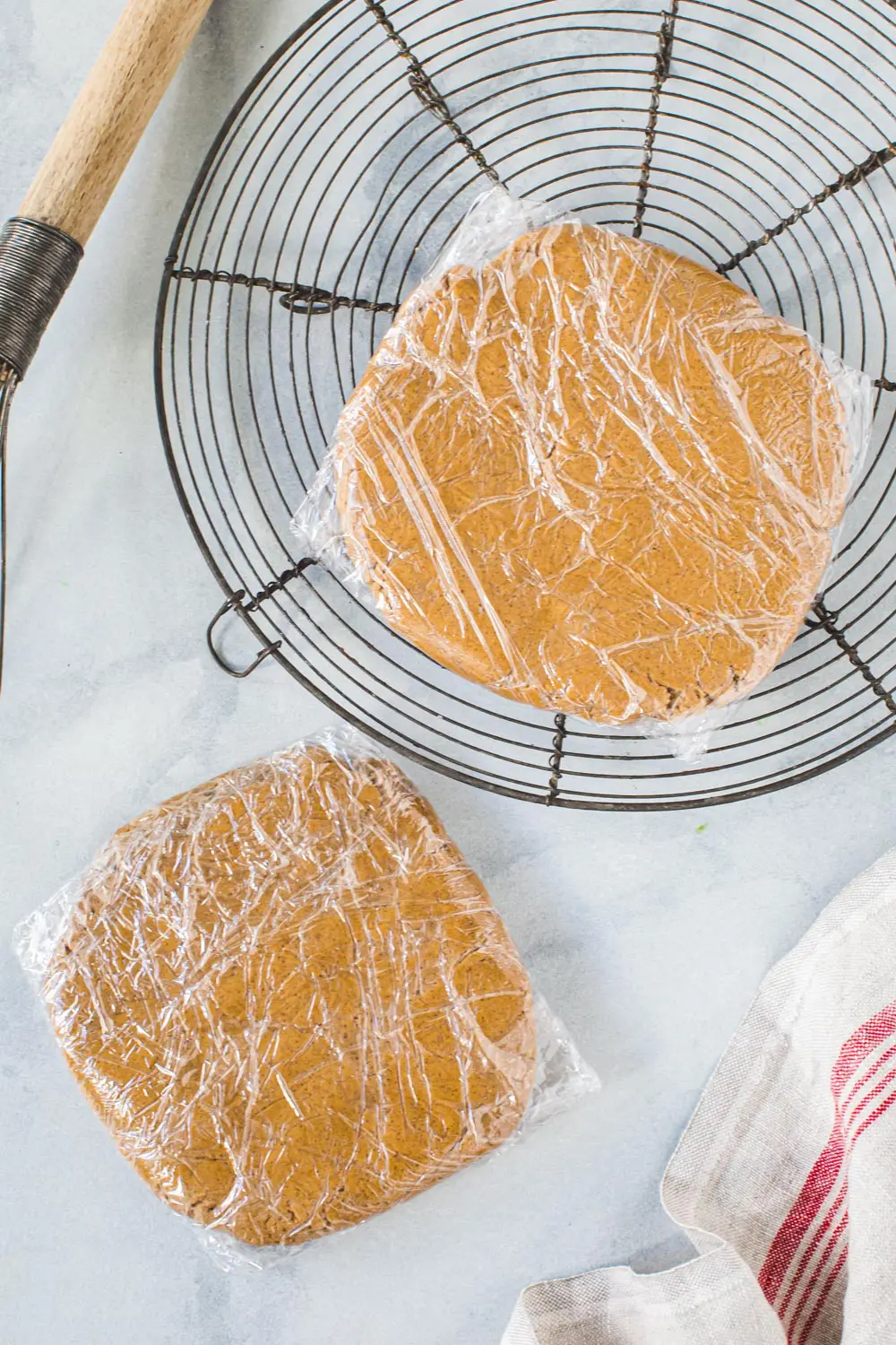 Gingerbread cookie dough in plastic wrap.