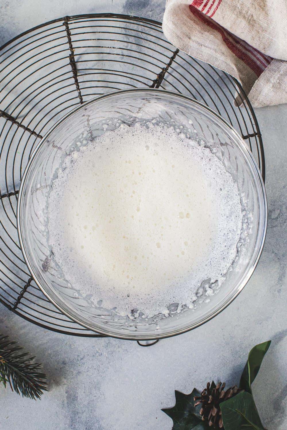 Gingerbread cutout cookie icing in a glass mixing bowl.