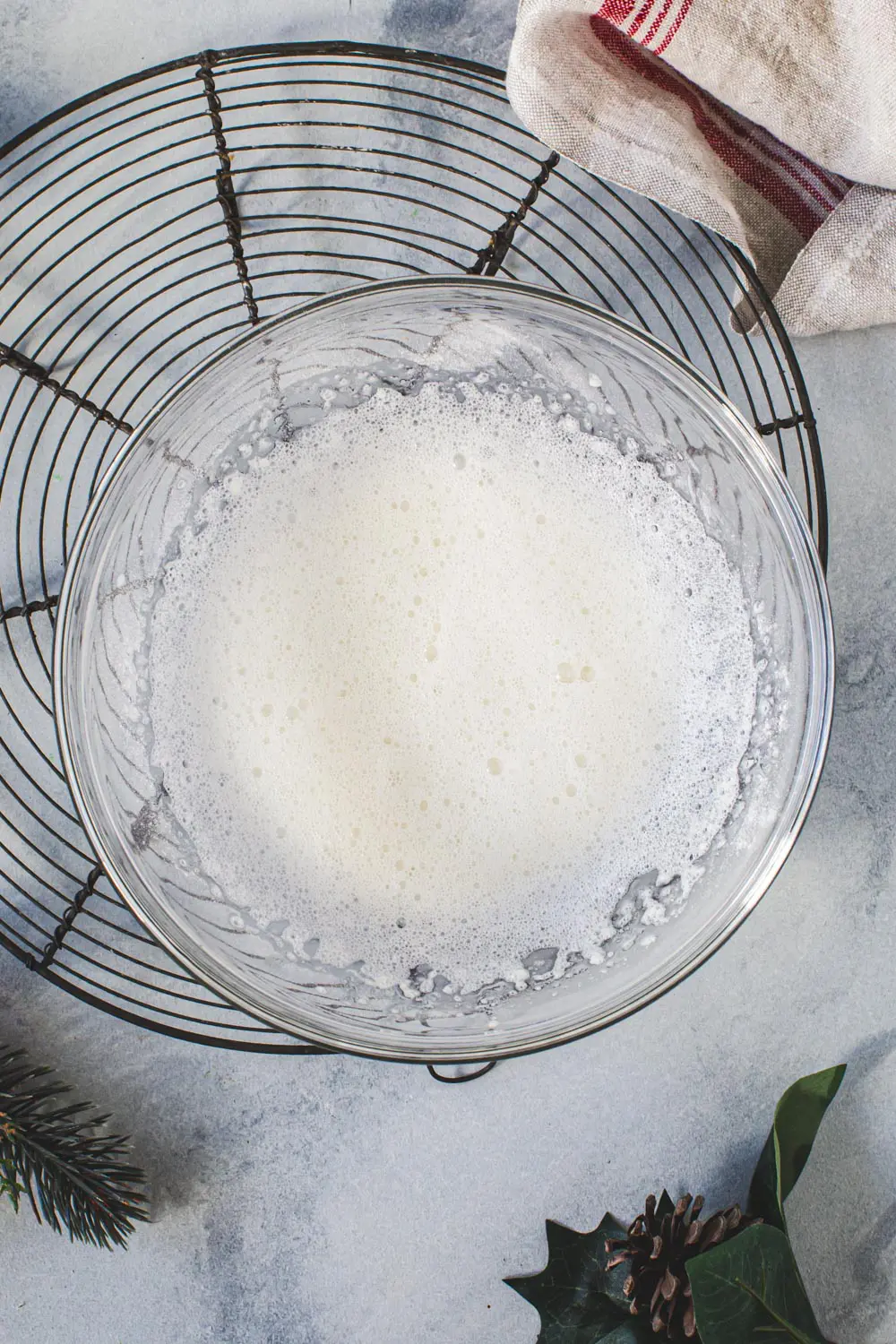 Gingerbread cutout cookie icing in a glass mixing bowl.