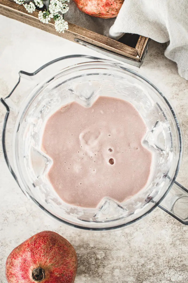 Pomegranate smoothie ingredients in the blender.