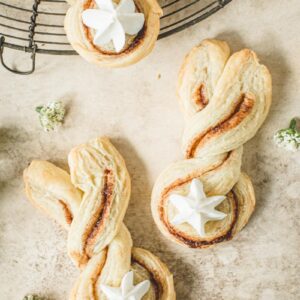 Cinnamon puff pastry twists in Easter bunny shape with a frosting tail.