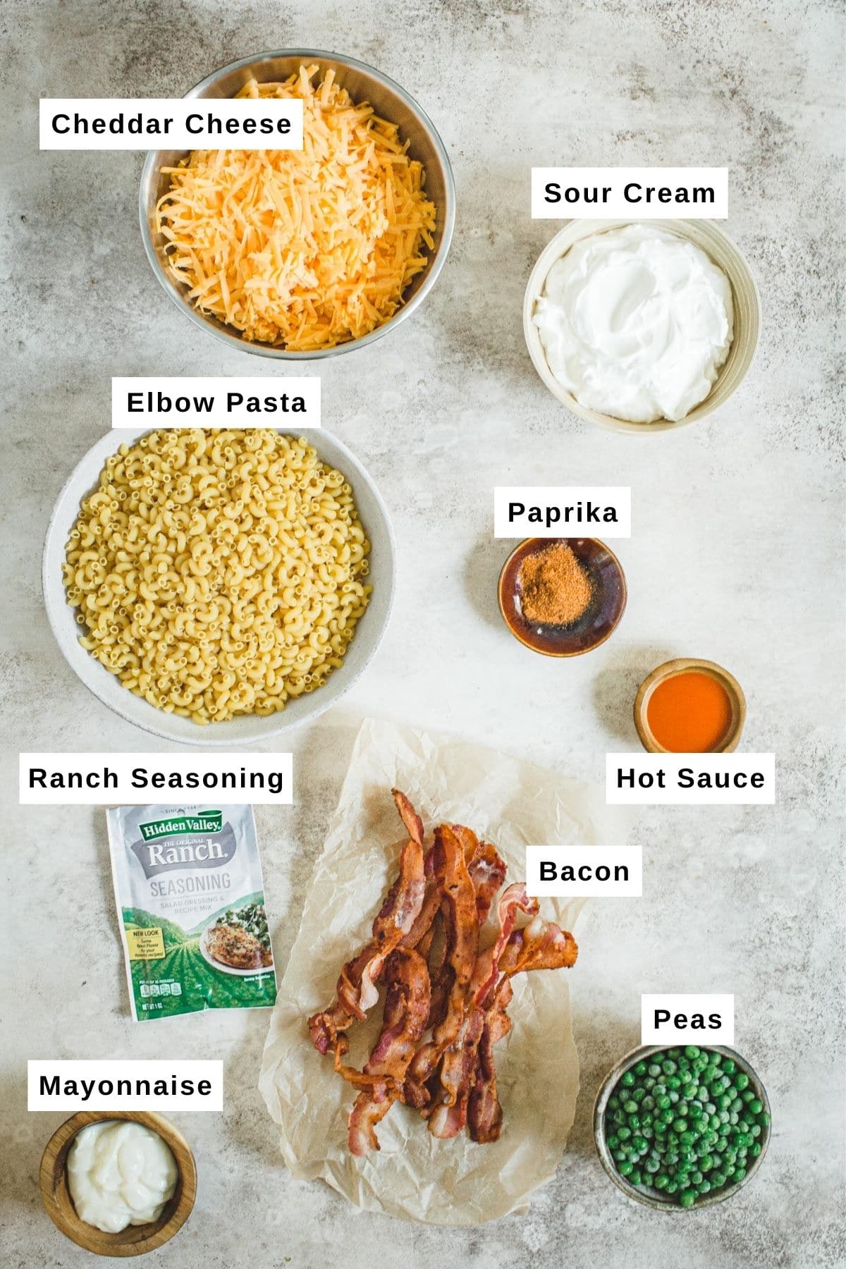 Bacon ranch pasta salad ingredients in bowls.