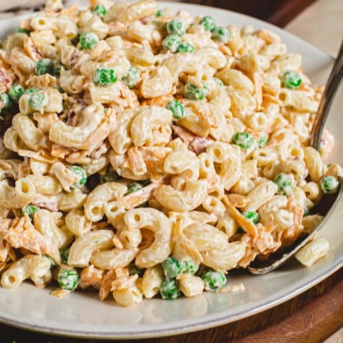 Bacon ranch pasta salad with peas in a bowl.