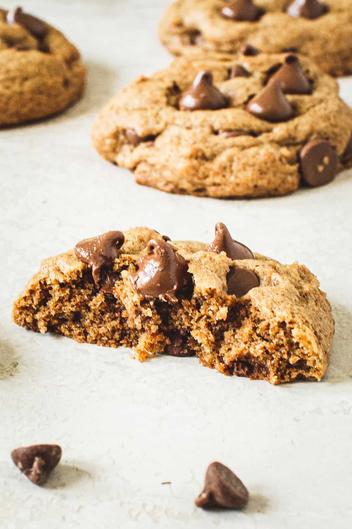Half of a whole wheat chocolate chip cookie.