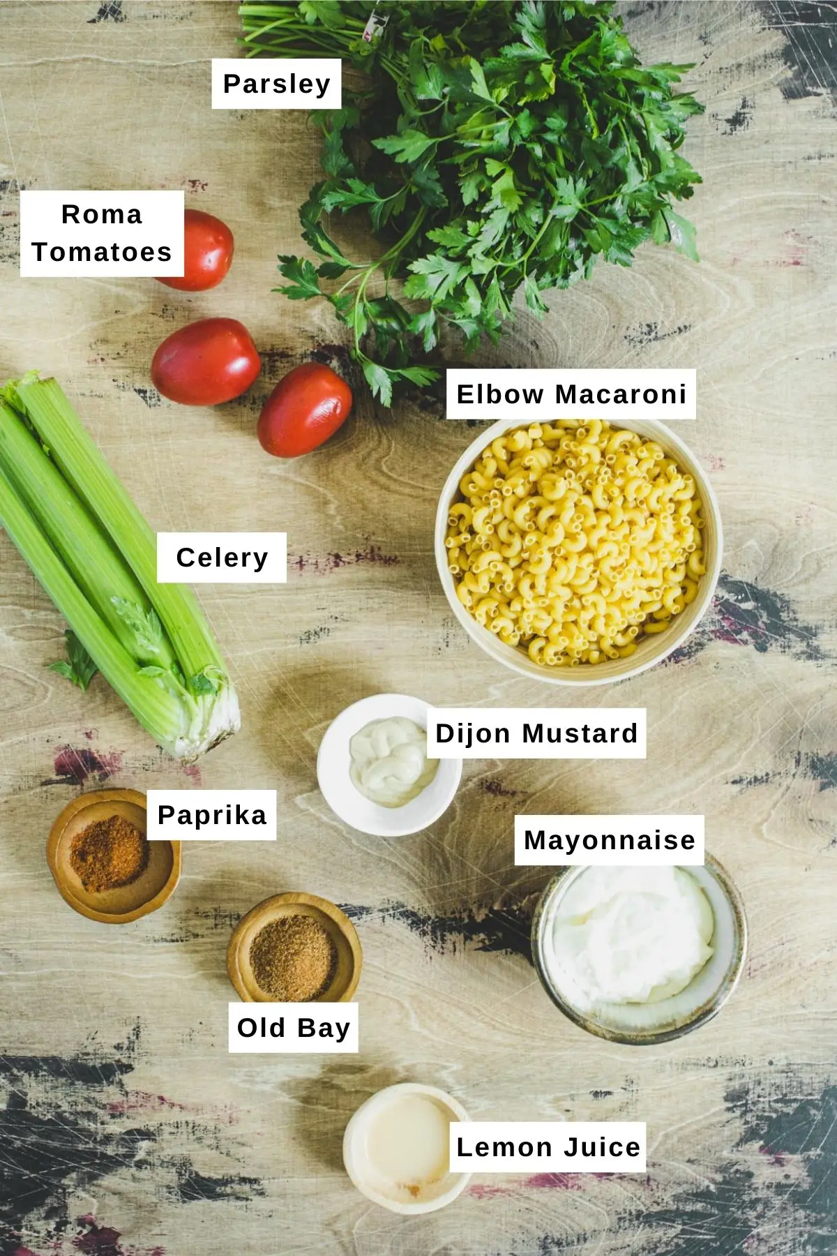 Southern macaroni salad ingredients laid out on table.