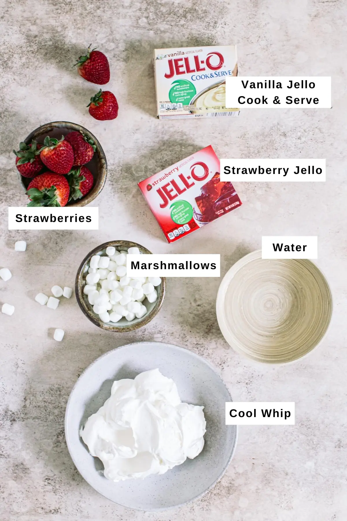 Ingredients for making strawberry Jello fluff salad in different bowls.