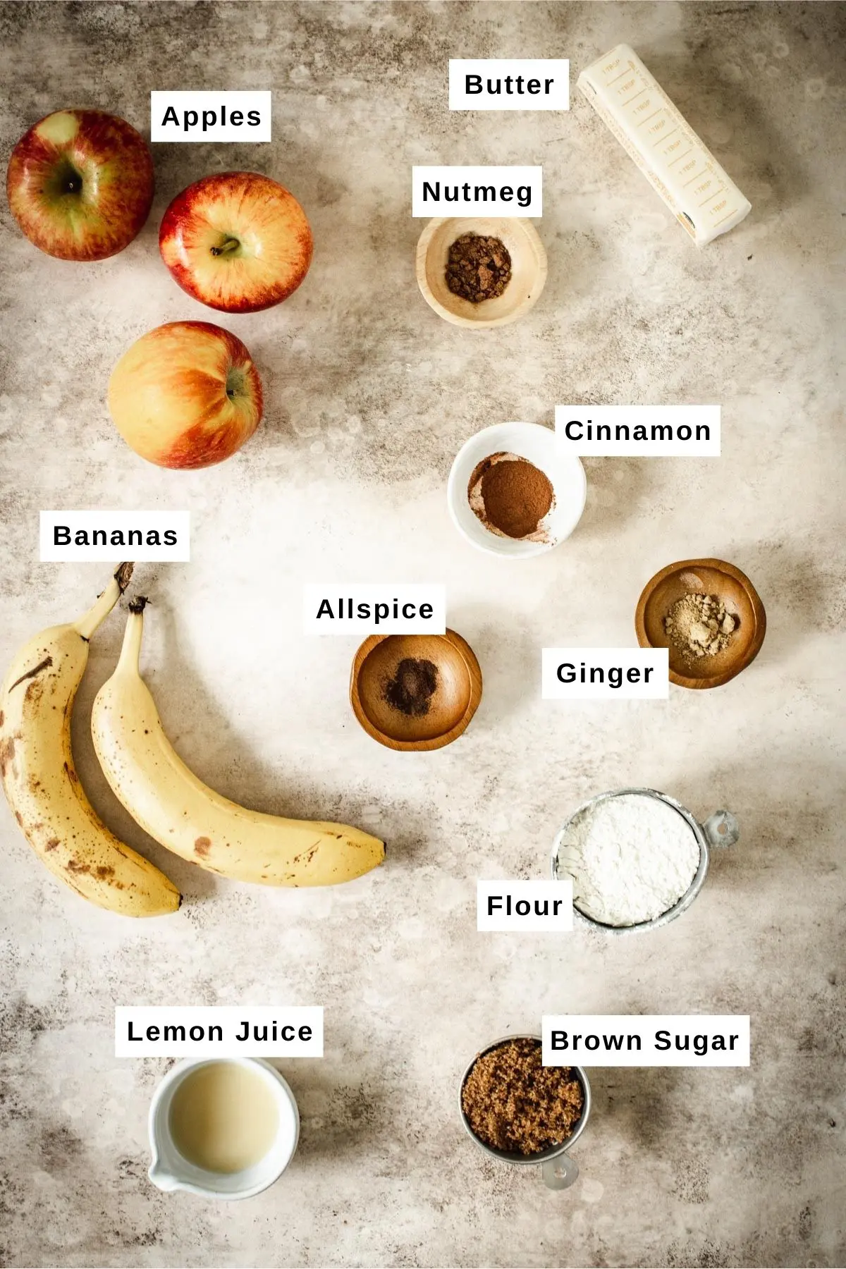 Baked apple crumble ingredients in bowls.