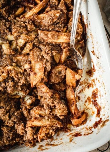 Baked apple crumble without oats in a baking dish.