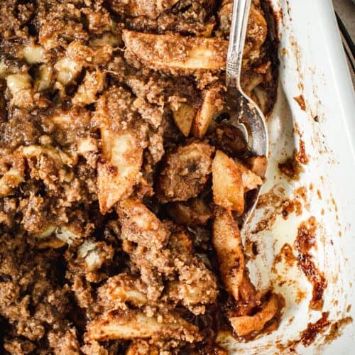 Baked apple crumble without oats in a baking dish.