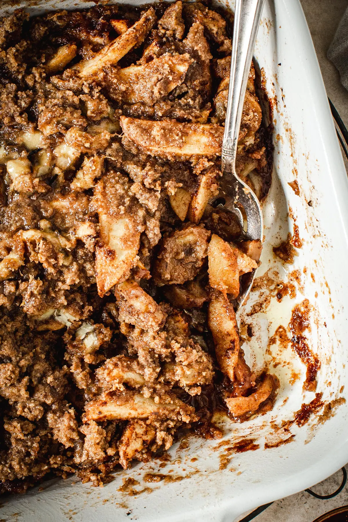 Baked apple crumble without oats in a baking dish.