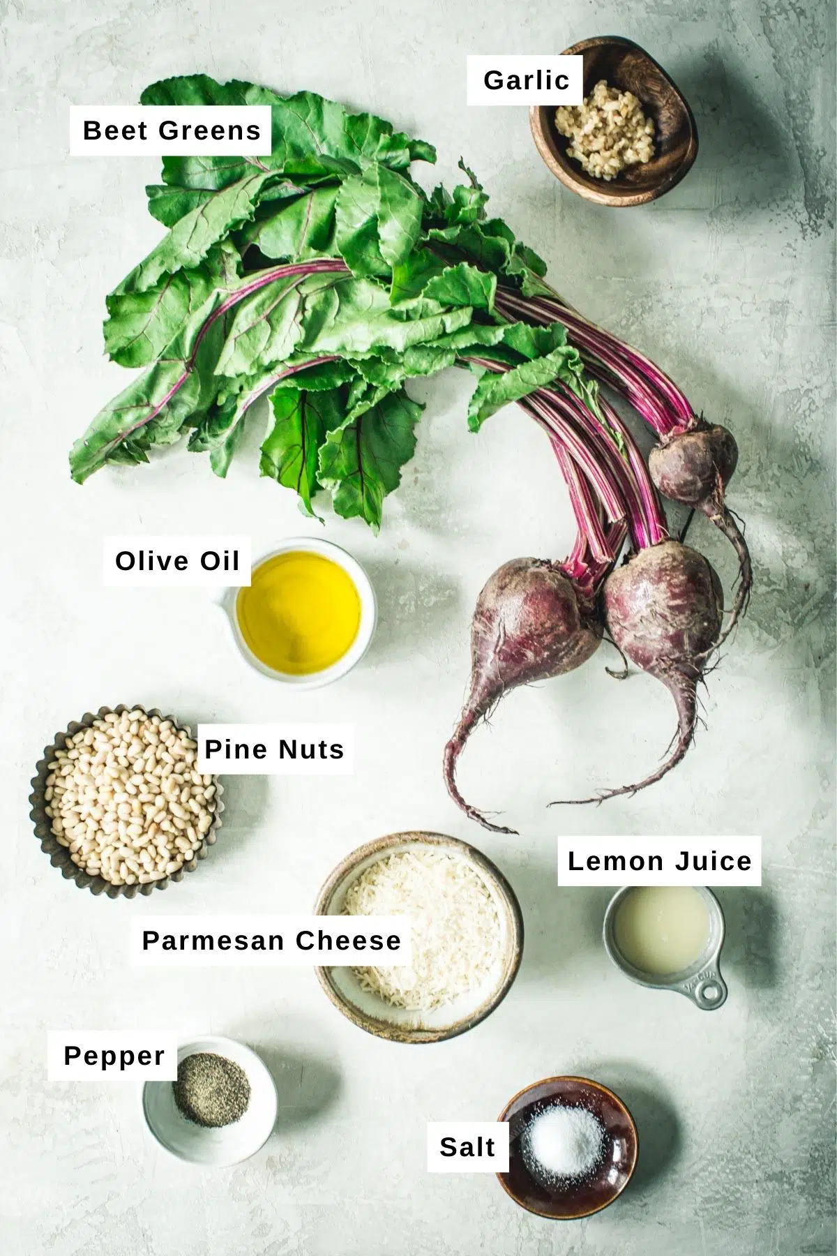 Beet greens pesto ingredients in bowls.