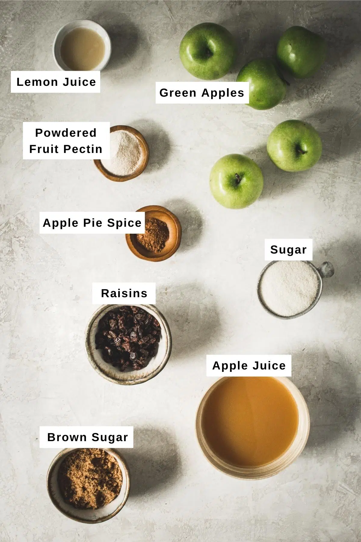 Apple jam ingredients in bowls.