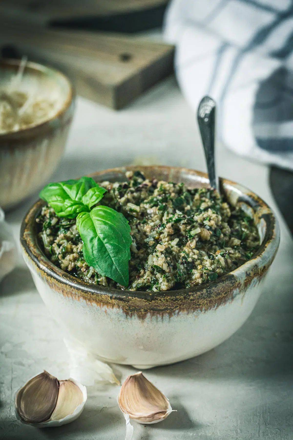 Homemade beet greens pesto in a pottery bowl.