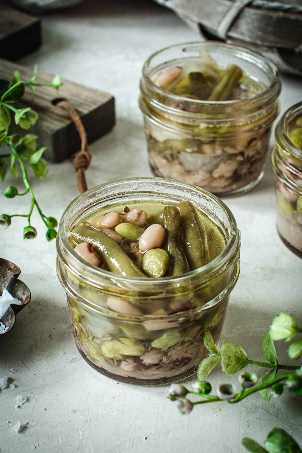 Pickled three bean salad in a half-pint jar.