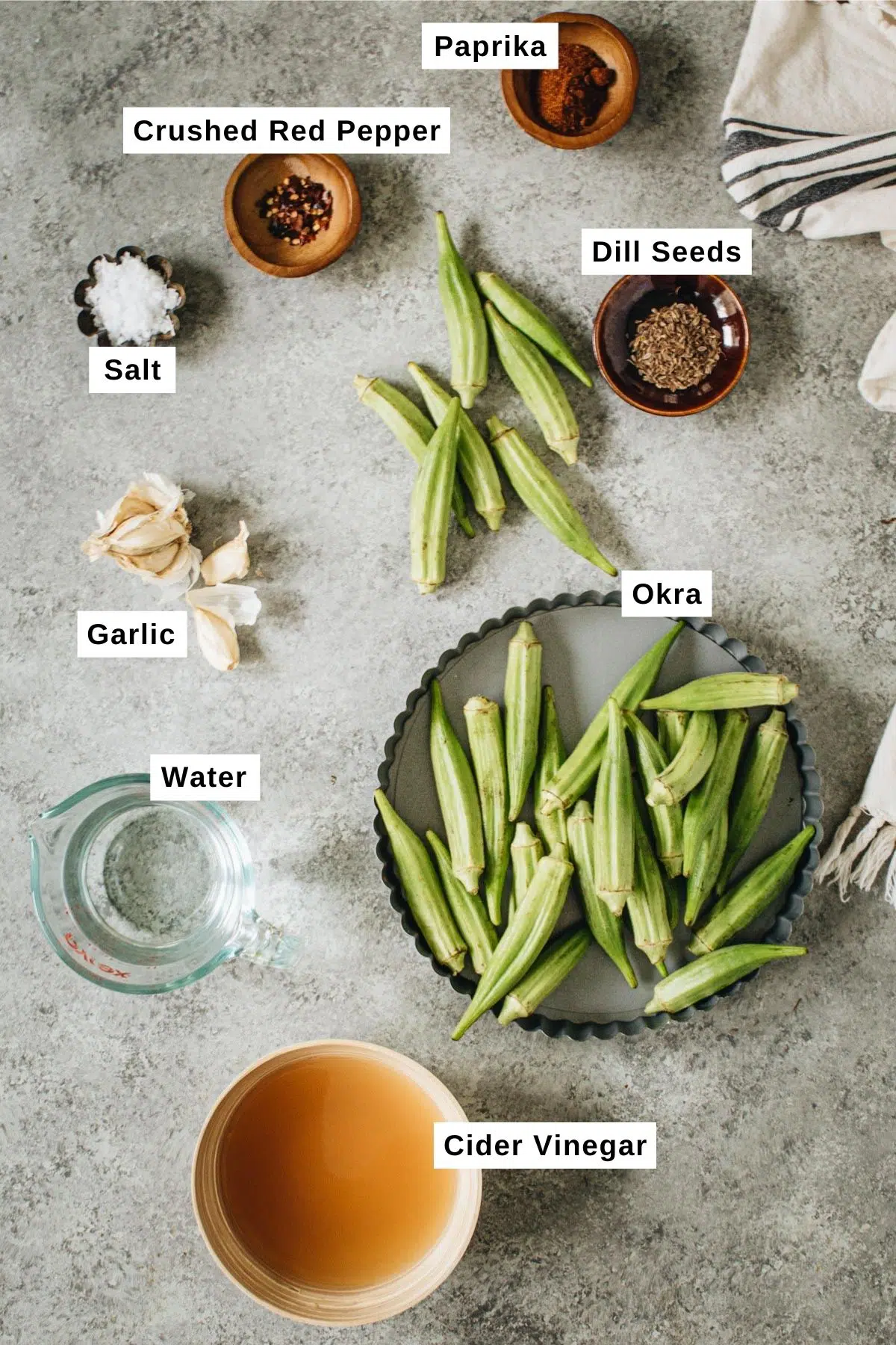 Pickled okra ingredients in different bowls.