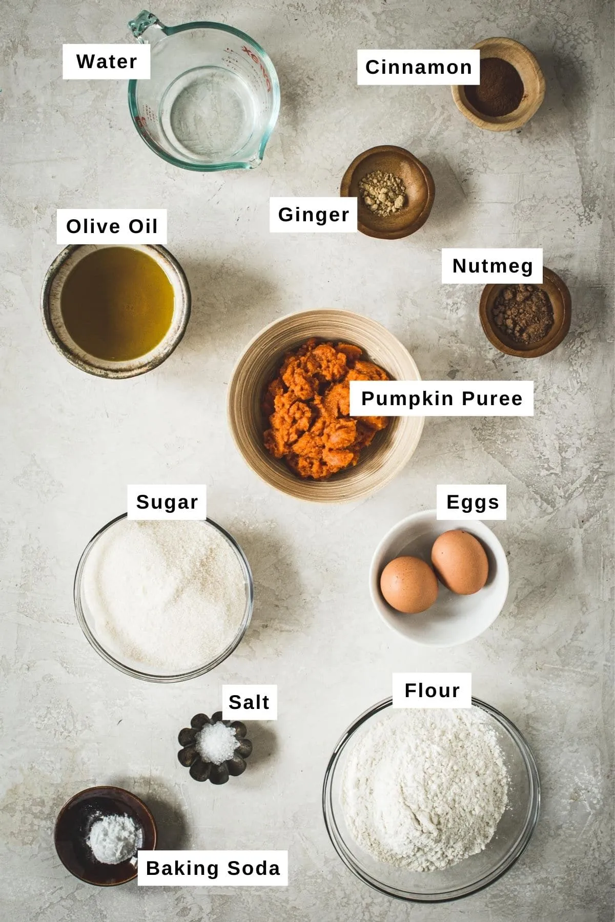 Pumpkin bread ingredients in various bowls.