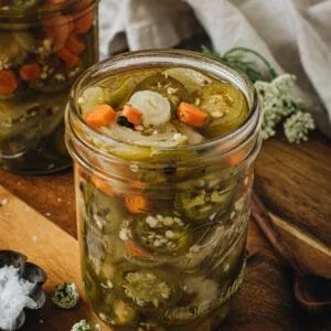 Taqueria style pickled jalapeños and carrots in a jar.