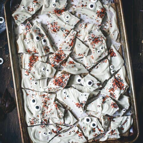 Halloween almond bark pieces on a rimmed baking sheet.