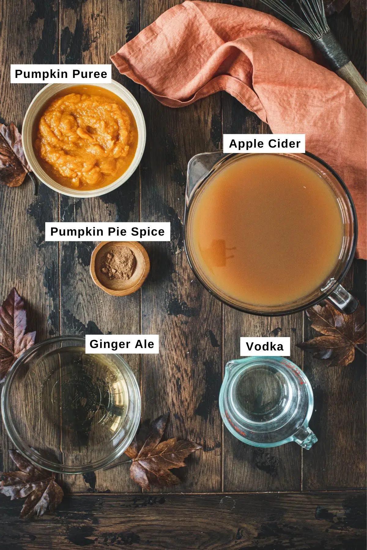 Halloween pumpkin punch ingredients in bowls.