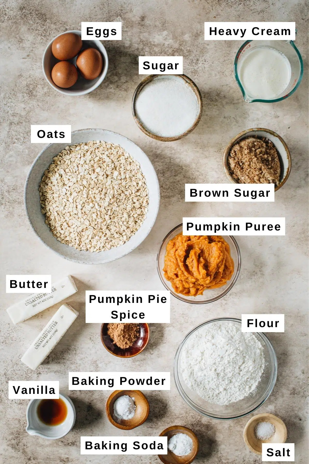 Pumpkin crisp ingredients in various sized bowls.
