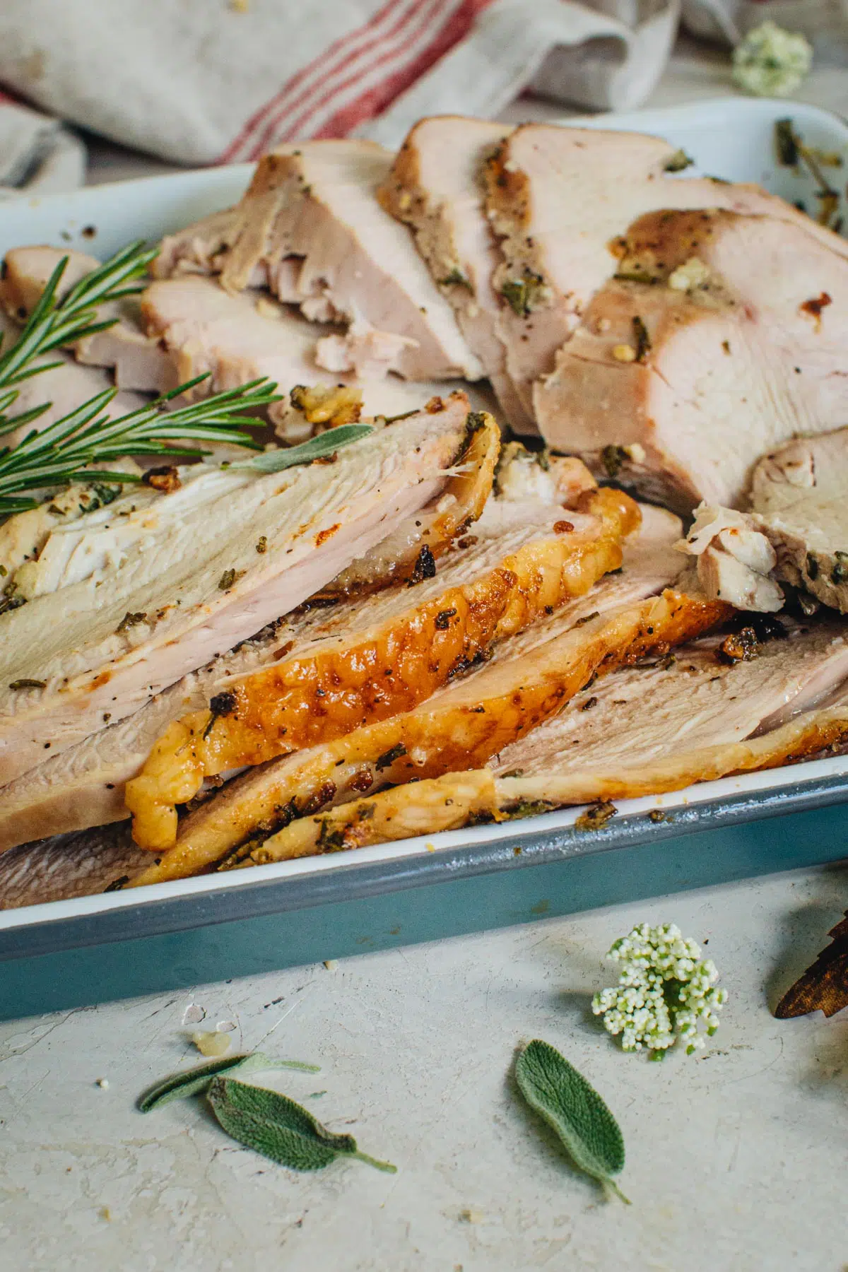 Slices of roasted turkey breast on a platter.