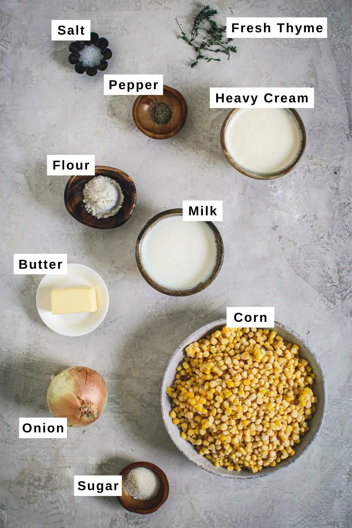 Creamed corn ingredients in different sized bowls.