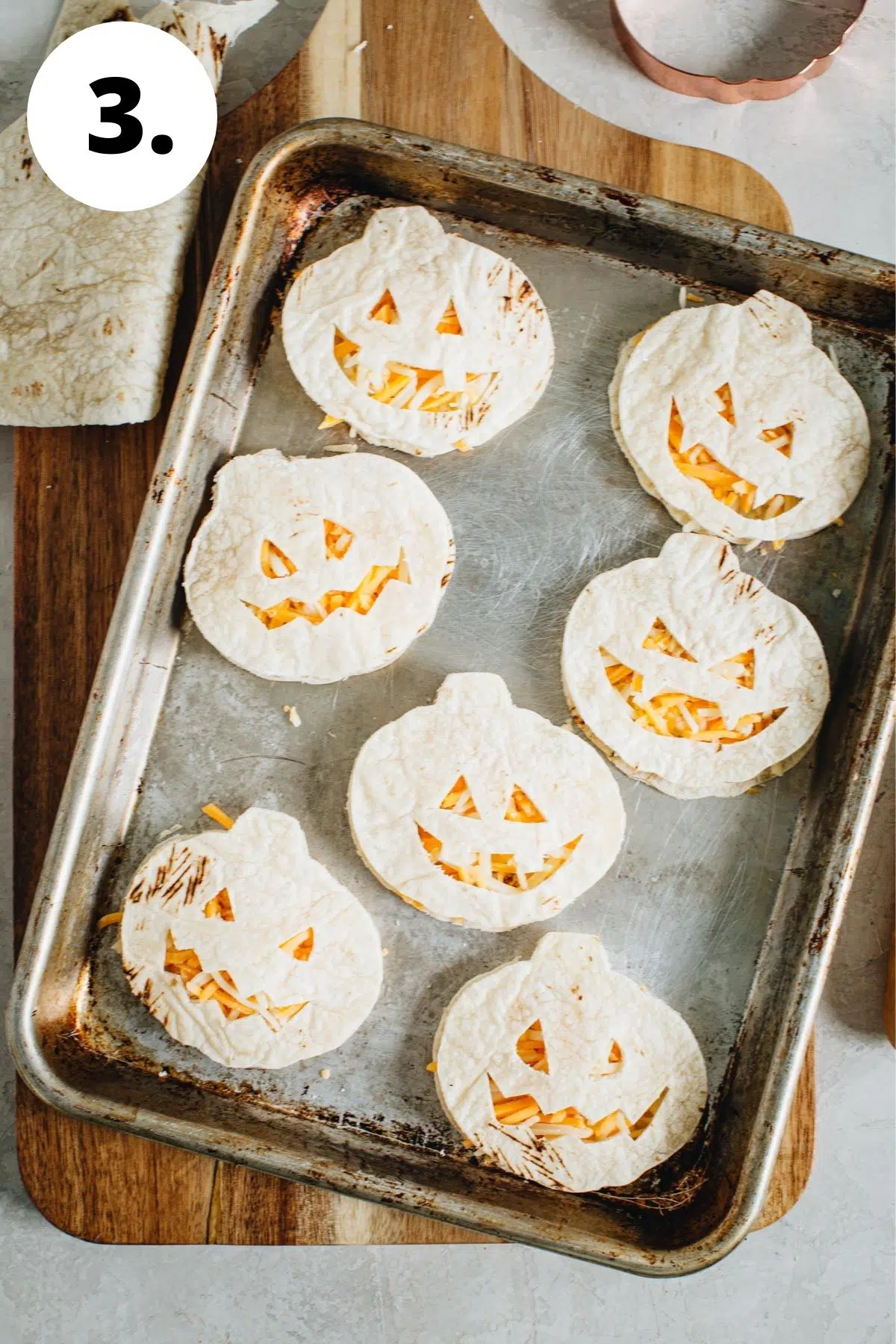 Jack-O-Lantern oven quesadillas process step 3.