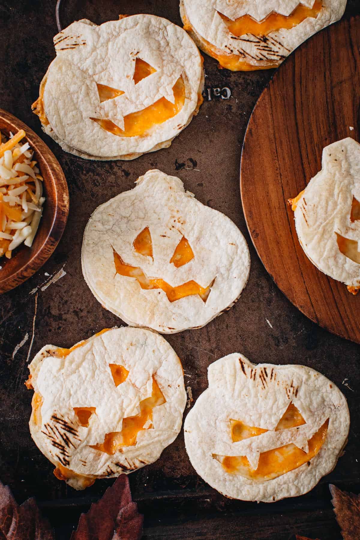 Pumpkin oven quesadillas on a baking sheet.