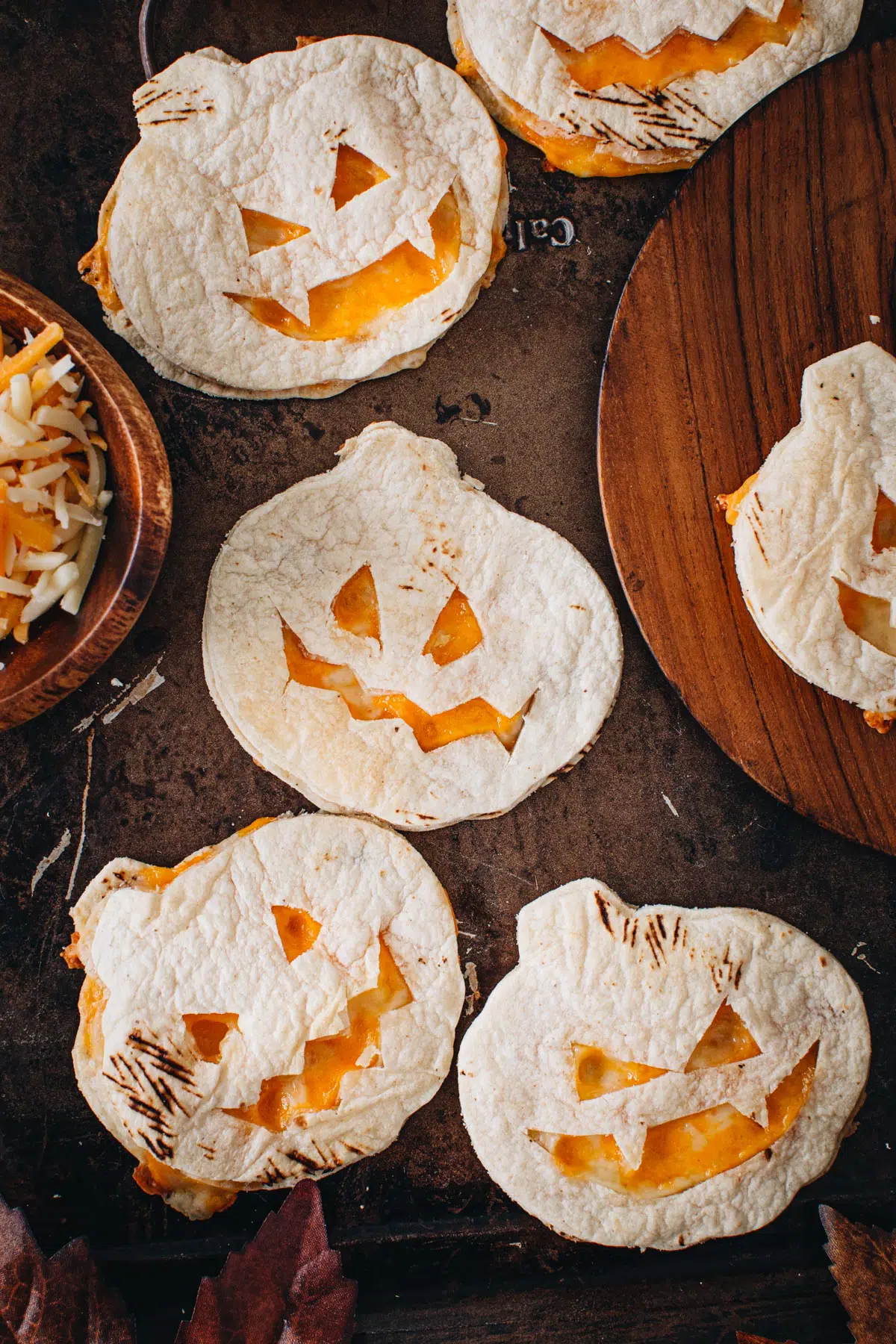Pumpkin oven quesadillas on a baking sheet.