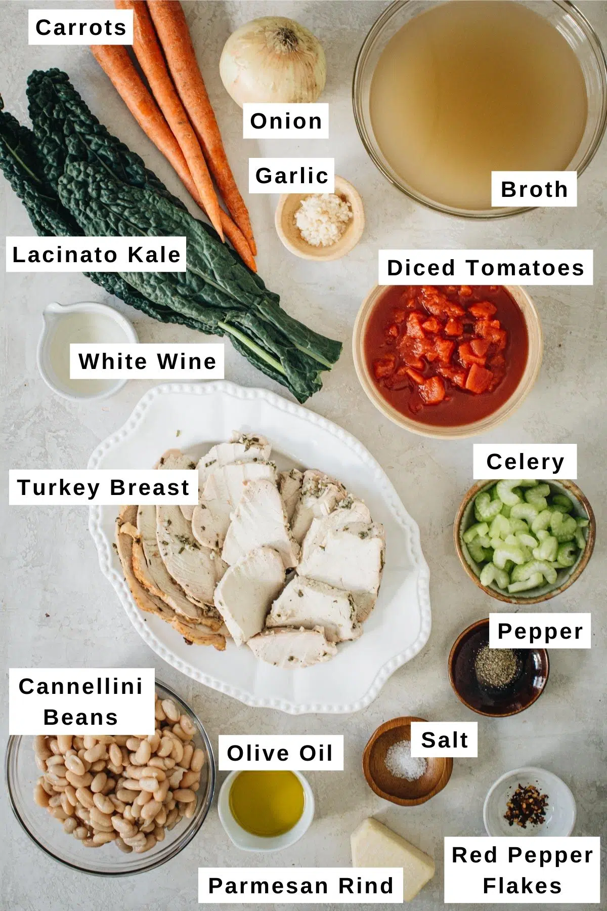Tuscan white bean soup ingredients in various bowls.