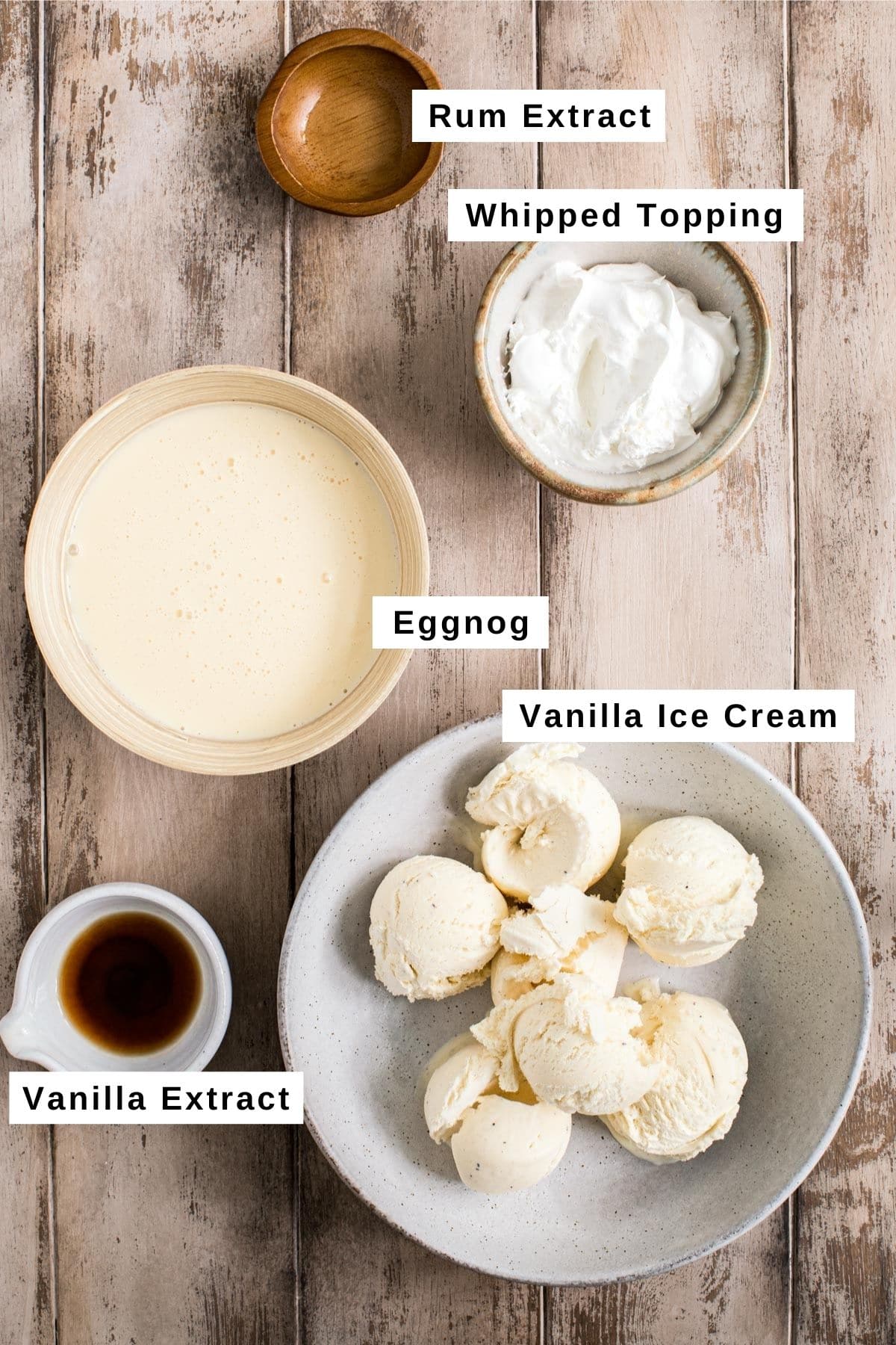 Eggnog milkshake ingredients in various bowls.
