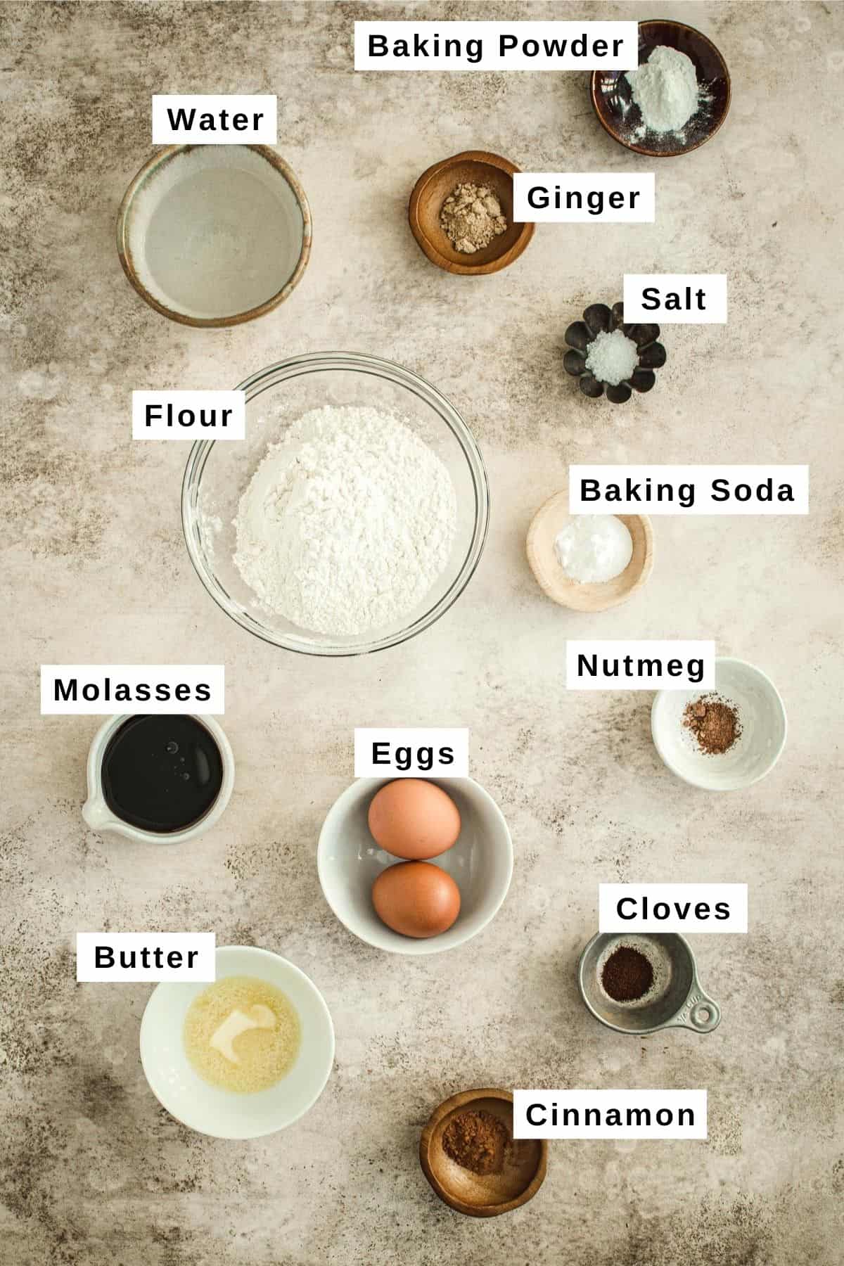 Gingerbread pancakes ingredients in various bowls.