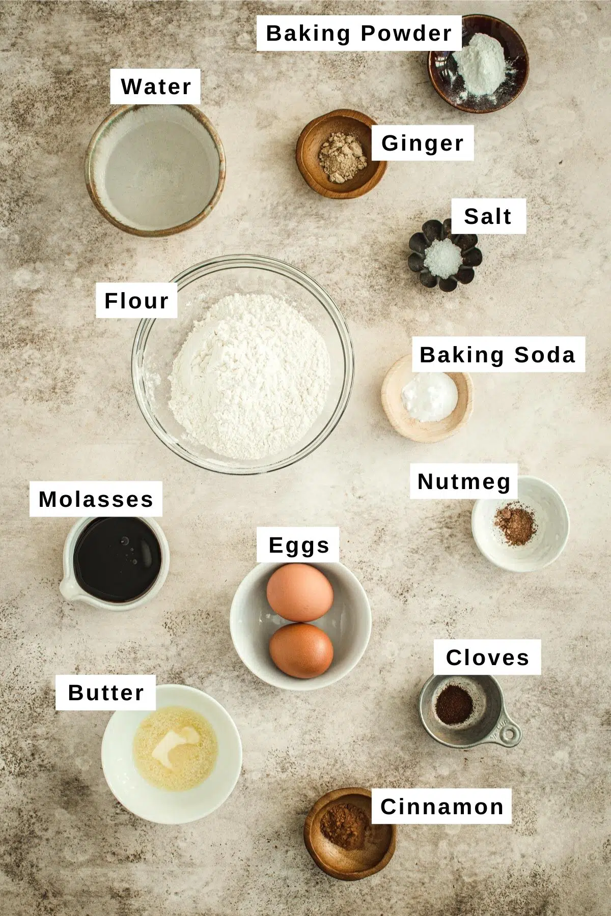 Gingerbread pancakes ingredients in various bowls.