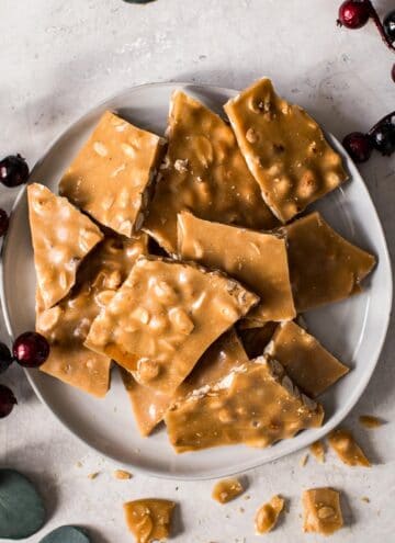 Microwave peanut brittle on a white plate.