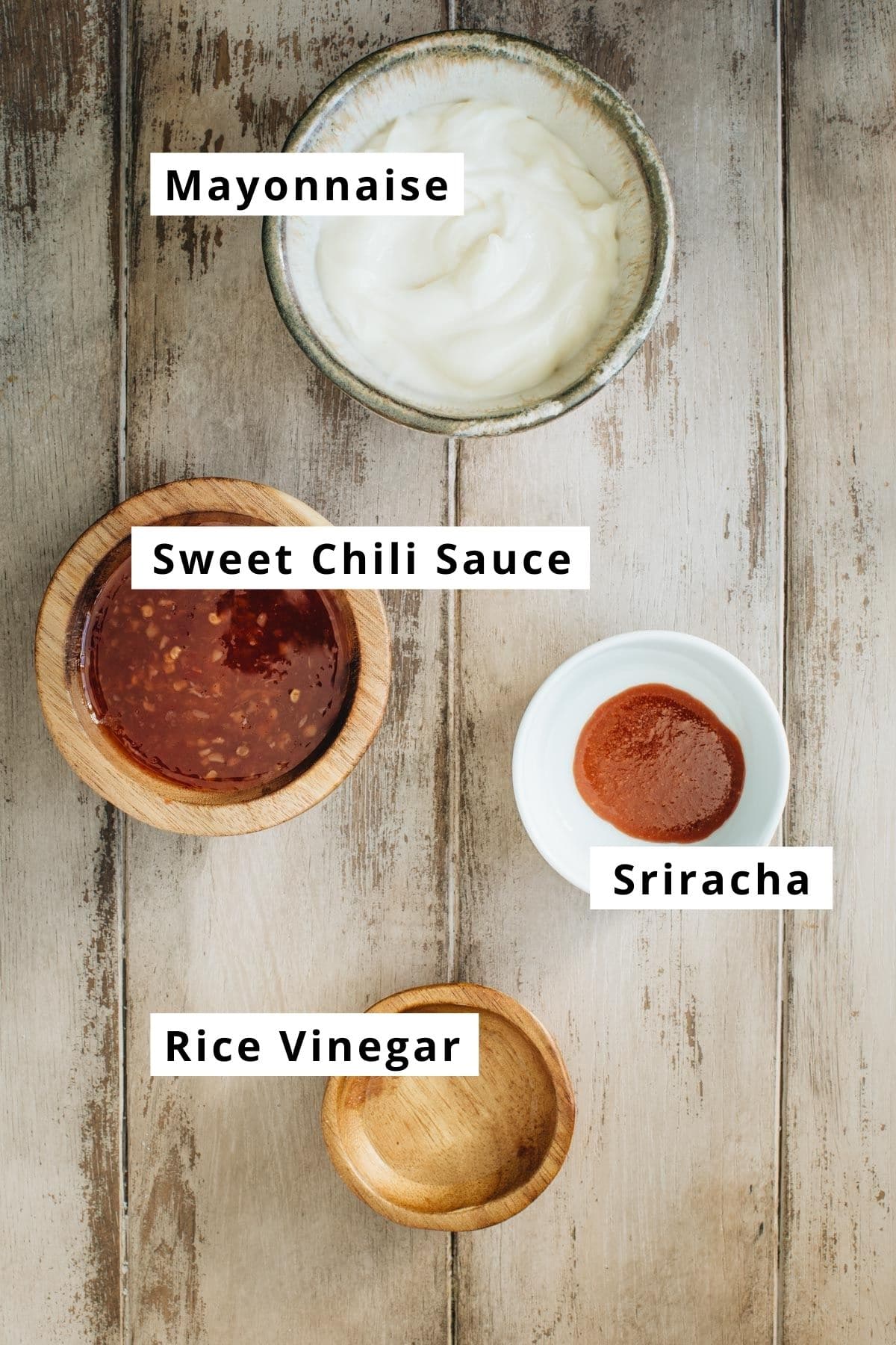 Bang bang sauce ingredients in various bowls.