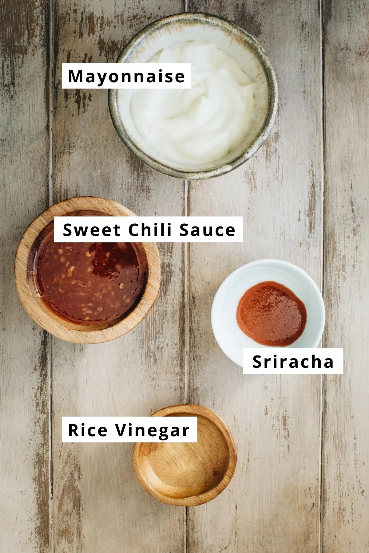 Bang bang sauce ingredients in various bowls.
