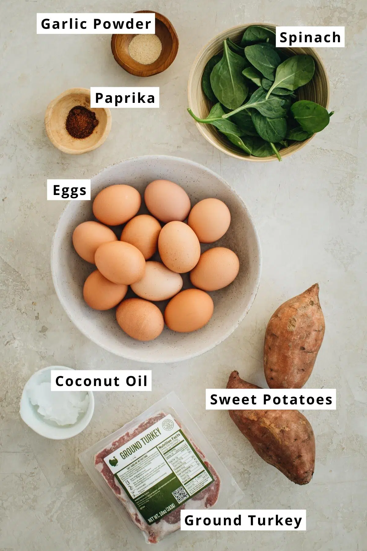 Egg breakfast casserole ingredients in various bowls.