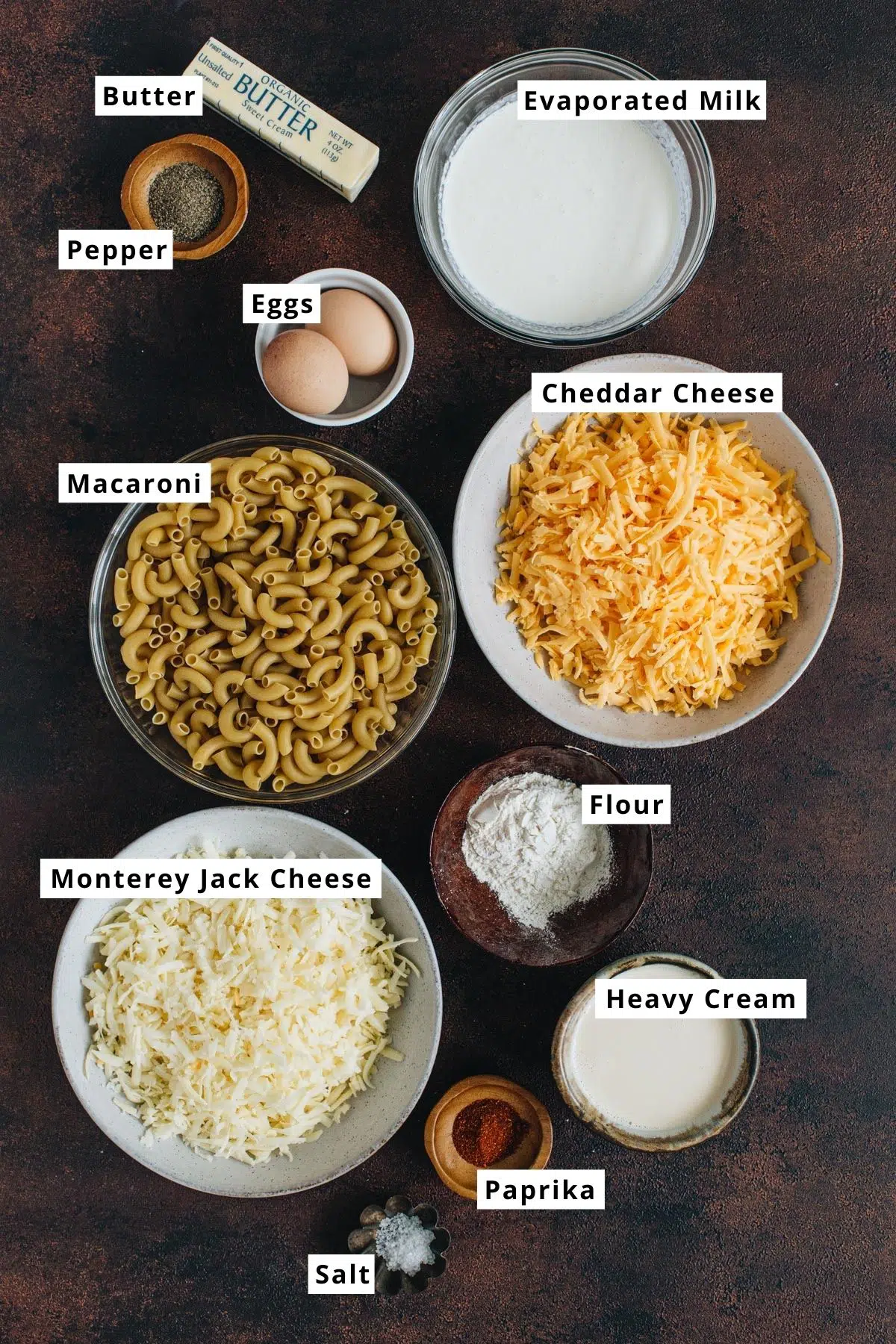 Southern baked mac and cheese ingredients in various bowls.