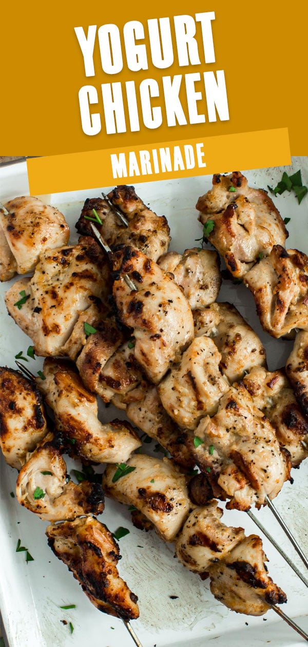 Yogurt marinaded chicken on skewers.