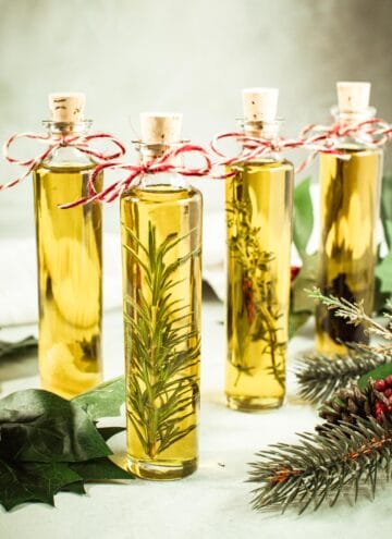 Infused olive oil in bottles with twine tied around the neck.