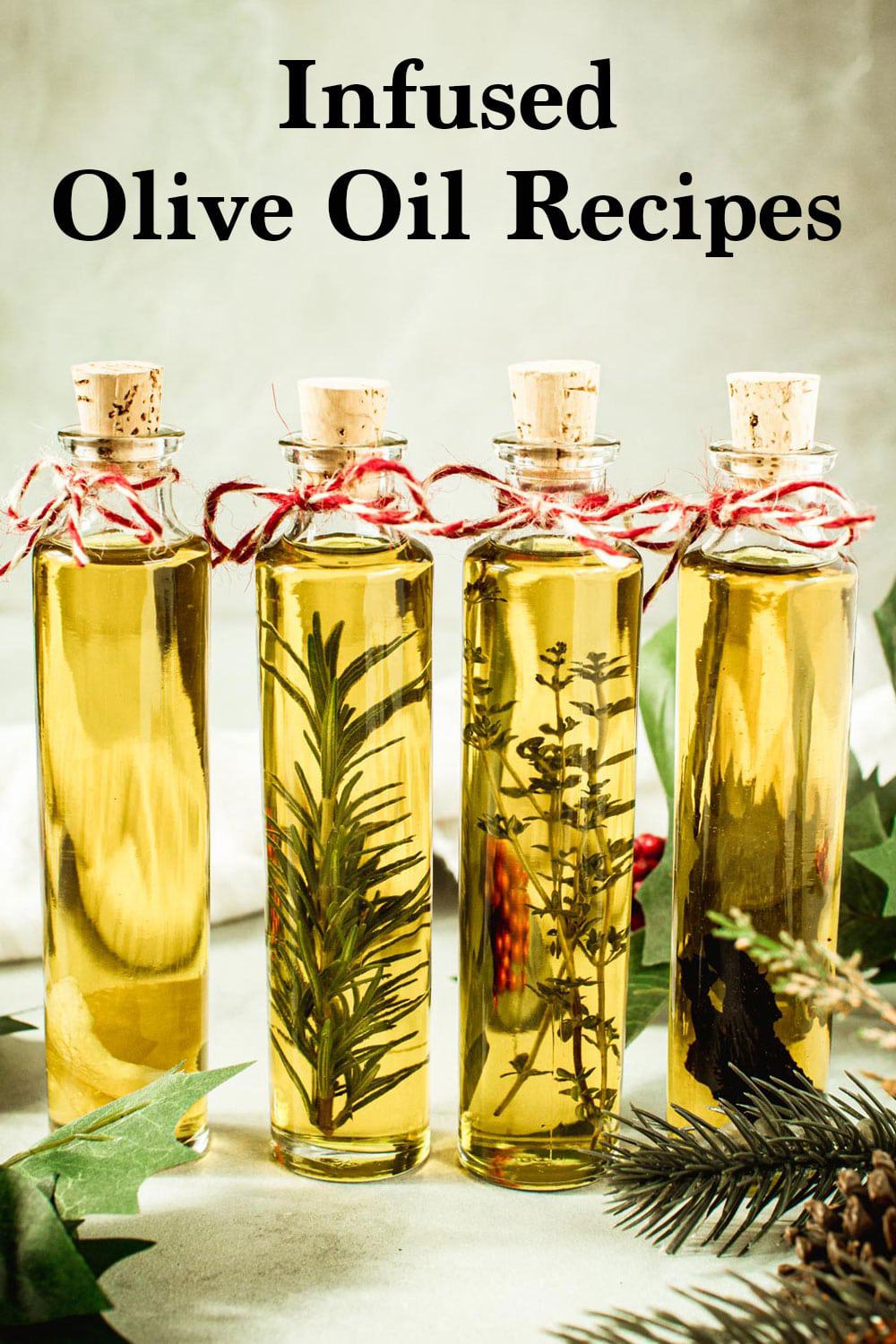 Bottles of infused olive oil with bakers string around the neck.